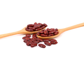 Red beans  in wooden spoon  isolated on white background