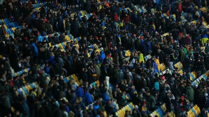 End of football game, thousands of sports fans leaving stadium after match