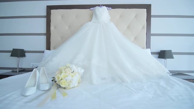 Wedding dress hanging on a shoulders, Wedding accessories