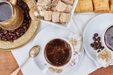 Traditional Turkish black coffee and sweet dainties