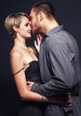 Young happy romantic couple in love kissing and hugging. Sexy po