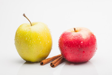 apples and cinnamon isolated on white