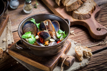 Tasty mussels in shells with garlic and red peppers