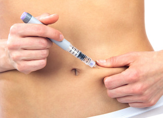 woman patient make an abdomen subcutaneous insulin syringe injec