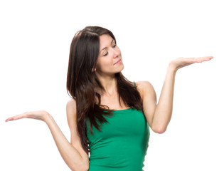 Fototapeta premium Portrait of young happy beautiful woman with comparing hand posi