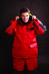 Fototapeta premium Young man putting on hood