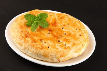 Dilkush -Plate of Homemade Sweet bread stuffed with raisins and coconut.