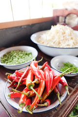 fresh red chilli in white and blue zinc bowl