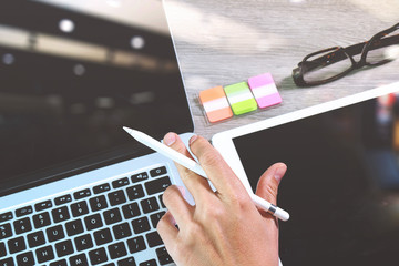 businessman hand working stylus pen and digital tablet computer
