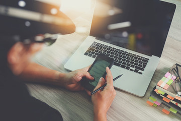 business man hand working on blank screen laptop computer and di