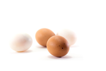 brown and white eggs isolated on white background