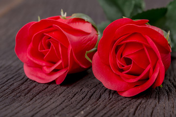 Fototapeta premium Valentine day with red rose on wood table