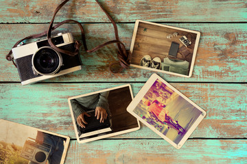 Photo album of hipster lifestyle journey trip in summer on wood table. instant photo of retro...
