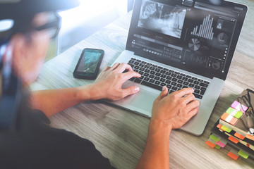 designer hand attending video conference with laptop computer an