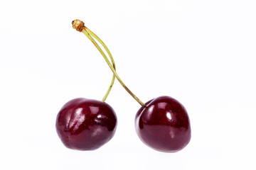 two fruits of red cherry isolated on white background