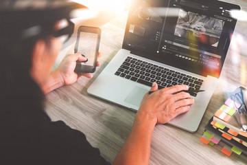 Fototapeta premium designer hand attending video conference with laptop computer an