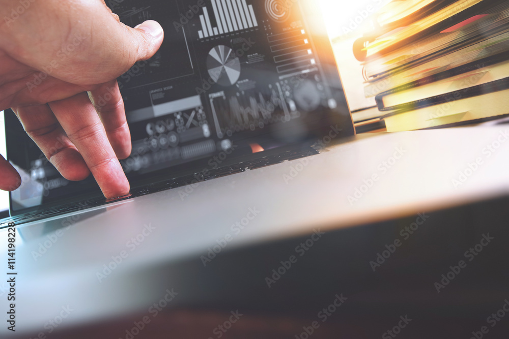 Wall mural close up of business man hand working on laptop computer with di