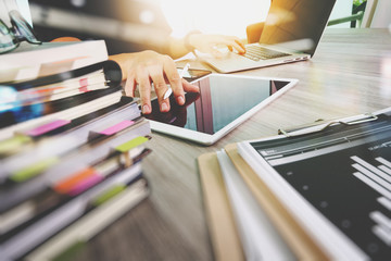 designer hand working with digital tablet and laptop computer an