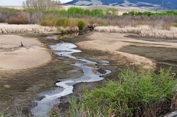 Rural Landscape with Water Running Through It 