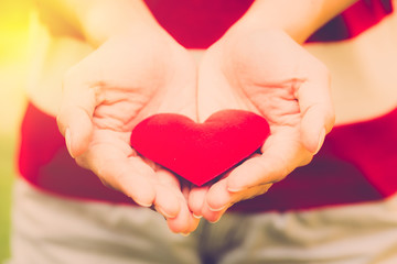 Hand hold love valentine heart. vintage filter