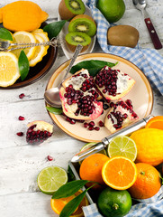 Fresh fruits  on a white wooden board.