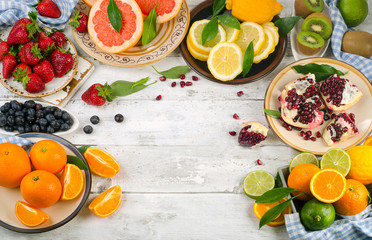 Healthy eating background. Different fruits and berries on  wood