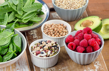 Fiber rich foods on a wooden board. Healthy diet eating.
