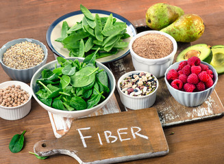 Fiber rich foods on wooden board.