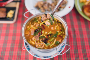 Tom Yam Kung ,thai food in wooden bowl 