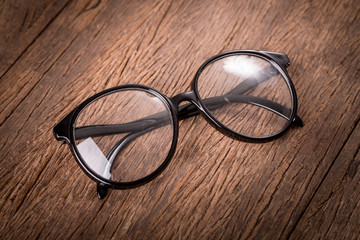 Eyeglasses on woodn background