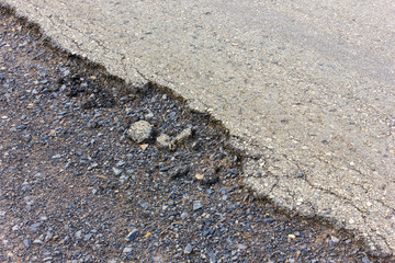 .Asphalt road surface crack ruins.