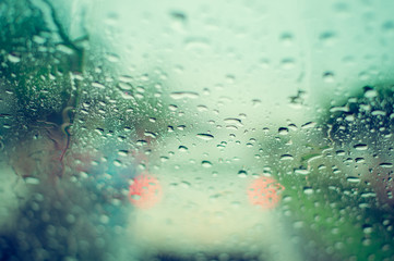 Rain drop on car window. Vintage filter