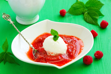 Scoop of ice cream with rhubarb compote.