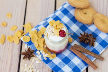 Fototapeta na wymiar yogurt with cherry jam and oat flakes