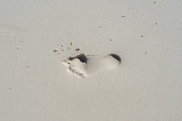 Footprint in sand from top view 