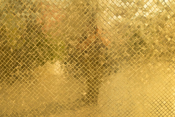 Texure of rich golden mosaic close up