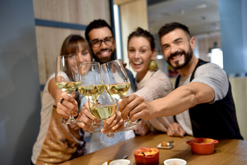 Portrait of friends in a bar drinking wine
