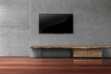 Led tvs on concrete wall with wooden furniture in empty living room