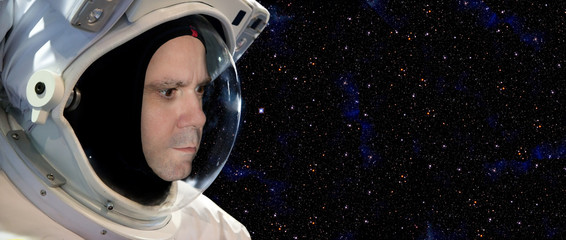 Astronaut on space mission with stars on the background © milkovasa