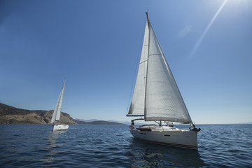 Fototapeta na wymiar Two luxury yachts sailing on the sea.