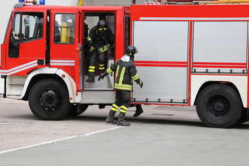 RED fire engine pulled up in front of the blazing building.