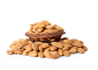 Almond on a wooden basket with against wooden background