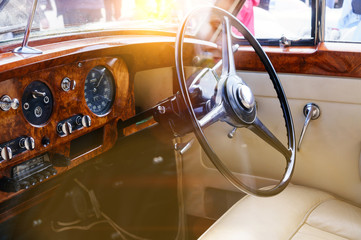 Interior of a classic vintage car with sun glare
