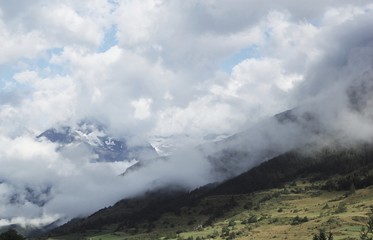 Cloudy green mountain landscape, Lanslevillard France