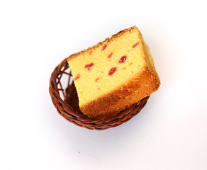 Pieces of Dessert cake with wooden basket