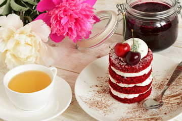 red cake with cherry