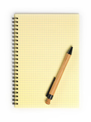 Yellow notebook with bamboo pen