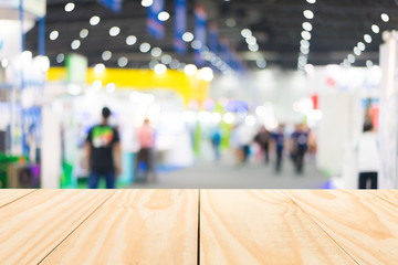 Wood table top on blur exhibition background