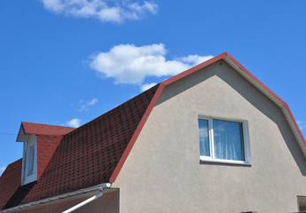 Close up on Attic Dormer Window and Roofing Construction.