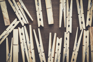 wooden clothes pegs on the brown table